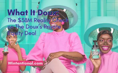 Two smiling women in pink holding The Doux hair products under salon hood dryers, titled What It Doux